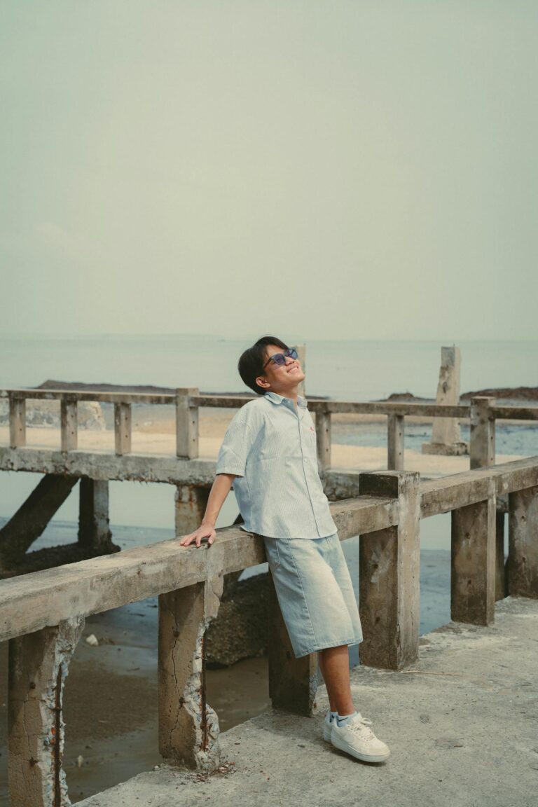 Casual summer day by the beach in Ho Chi Minh City, Vietnam. A relaxed young man soaking up the sun.